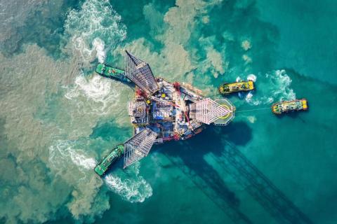Supply boats towing an oil drilling rig, São Tomé and Príncipe.